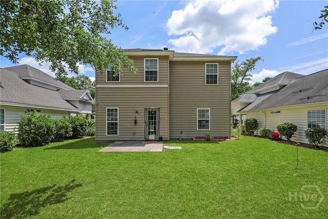 98 Peregrine Cir, Richmond Hill, GA 31324 - rear view of property featuring a patio area and a yard