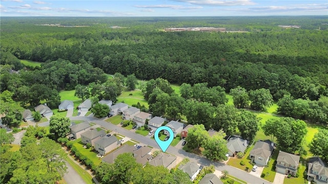98 Peregrine Cir, Richmond Hill, GA 31324 - aerial view of property's location featuring a heavily wooded area and nearby suburban area