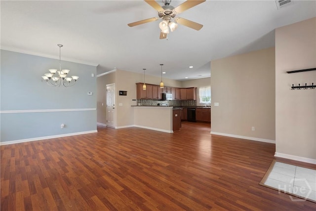 98 Peregrine Cir, Richmond Hill, GA 31324 - unfurnished living room featuring dark wood-style floors, a chandelier, ceiling fan, crown molding, and recessed lighting