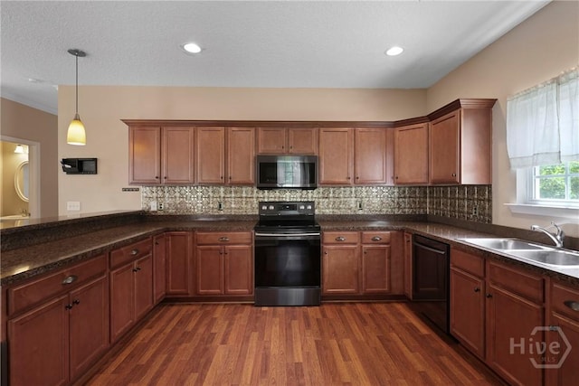 98 Peregrine Cir, Richmond Hill, GA 31324 - kitchen featuring black electric range, stainless steel microwave, dishwasher, dark wood-type flooring, and tasteful backsplash