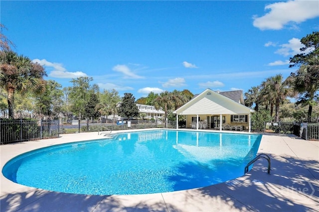 98 Peregrine Cir, Richmond Hill, GA 31324 - community pool featuring a patio area