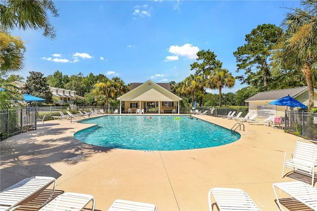 98 Peregrine Cir, Richmond Hill, GA 31324 - community pool featuring a patio area