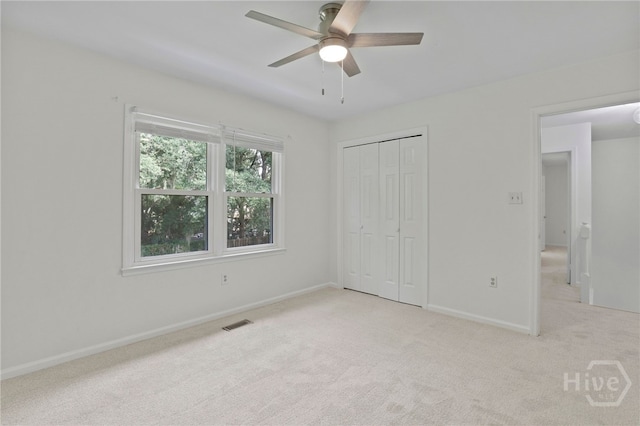 103 Olde Towne Rd, Savannah, GA 31410 - unfurnished bedroom with light colored carpet, a closet, and ceiling fan