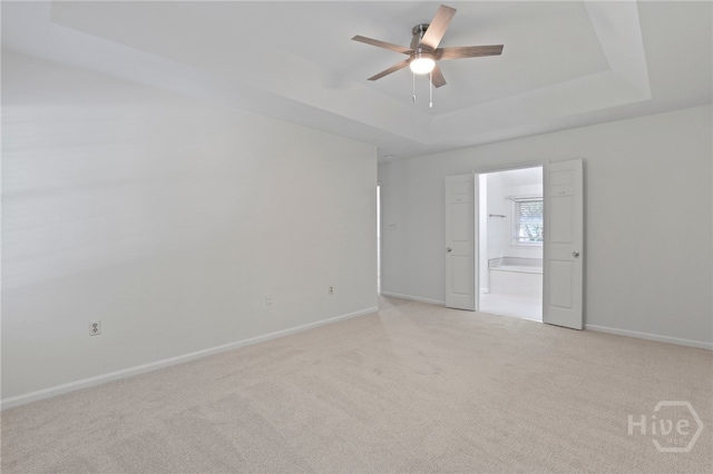 103 Olde Towne Rd, Savannah, GA 31410 - unfurnished room with a raised ceiling, ceiling fan, and light colored carpet