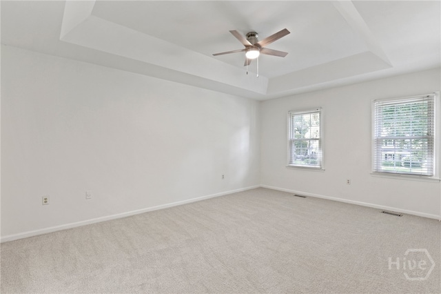 103 Olde Towne Rd, Savannah, GA 31410 - spare room with a tray ceiling, ceiling fan, and light carpet