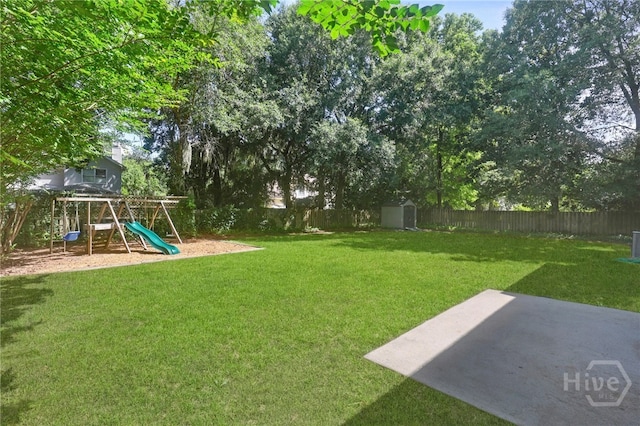 103 Olde Towne Rd, Savannah, GA 31410 - fenced backyard featuring a playground, a shed, and a patio area