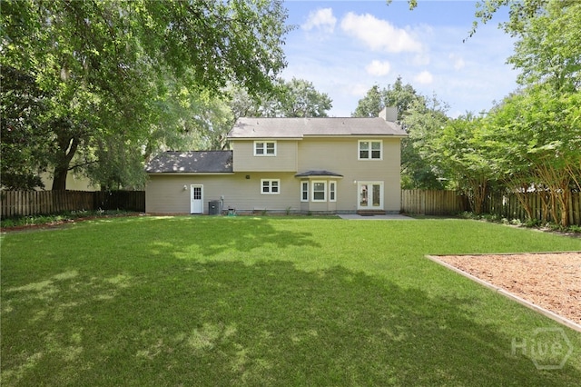 103 Olde Towne Rd, Savannah, GA 31410 - rear view of property with a fenced backyard, french doors, a chimney, and a patio