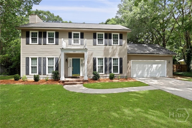 103 Olde Towne Rd, Savannah, GA 31410 - view of front of home featuring a chimney, a garage, driveway, and a balcony