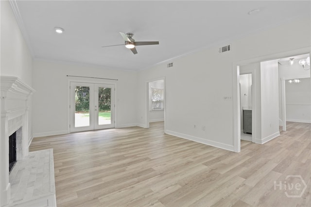 103 Olde Towne Rd, Savannah, GA 31410 - unfurnished living room featuring a fireplace, ceiling fan, crown molding, light wood-type flooring, and french doors