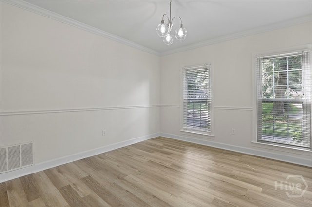 103 Olde Towne Rd, Savannah, GA 31410 - empty room featuring light wood-type flooring, ornamental molding, and a chandelier