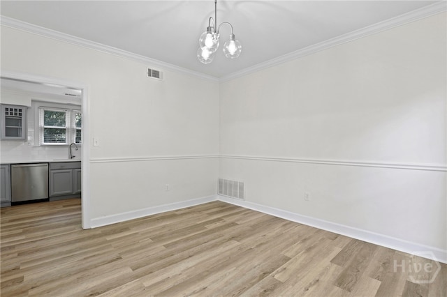 103 Olde Towne Rd, Savannah, GA 31410 - unfurnished dining area featuring light wood finished floors, a chandelier, and crown molding