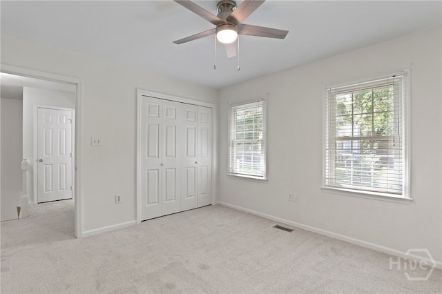 103 Olde Towne Rd, Savannah, GA 31410 - unfurnished bedroom with carpet floors, a closet, and a ceiling fan