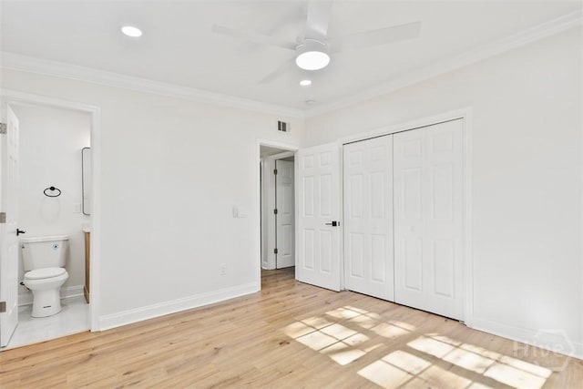 4630 Herty Dr, Savannah, GA 31405 - unfurnished bedroom featuring crown molding, light wood finished floors, a closet, ensuite bath, and recessed lighting