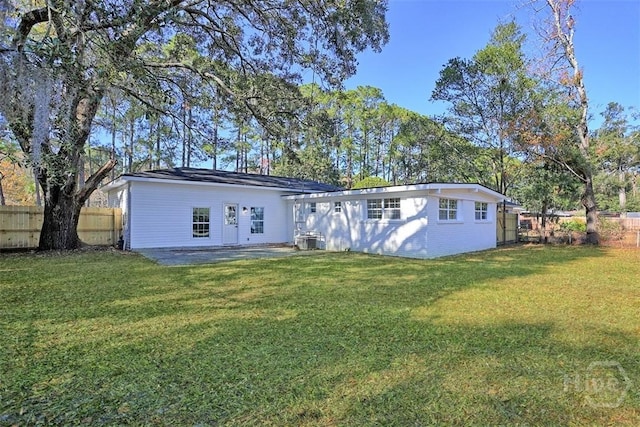 4630 Herty Dr, Savannah, GA 31405 - rear view of property with a fenced backyard and a patio