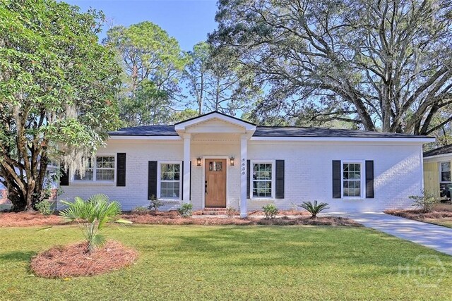 4630 Herty Dr, Savannah, GA 31405 - view of front facade with brick siding and a front yard