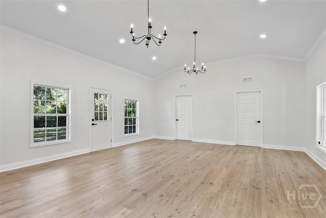 4630 Herty Dr, Savannah, GA 31405 - unfurnished living room with a chandelier, ornamental molding, light wood finished floors, recessed lighting, and high vaulted ceiling