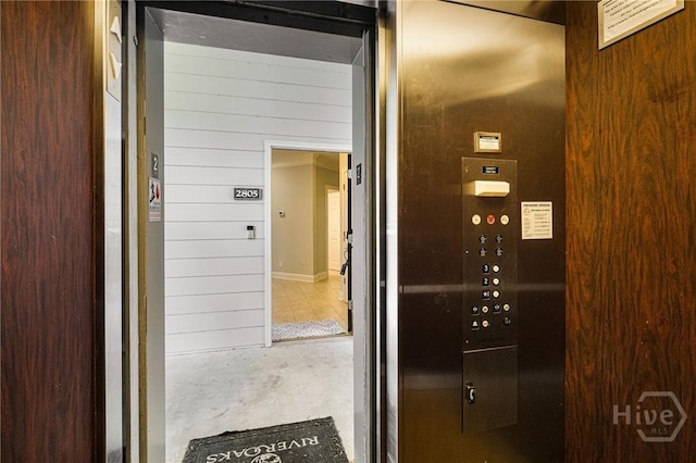 2805 River Oaks Dr Unit 2805, Richmond Hill, GA 31324 - elevator with wood walls and concrete flooring