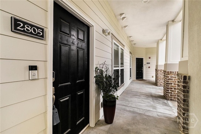 2805 River Oaks Dr Unit 2805, Richmond Hill, GA 31324 - view of exterior entry featuring a porch