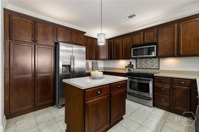 2805 River Oaks Dr Unit 2805, Richmond Hill, GA 31324 - kitchen featuring appliances with stainless steel finishes, light countertops, pendant lighting, a kitchen island, and dark brown cabinetry