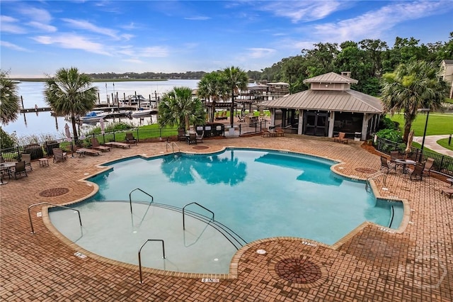 2805 River Oaks Dr Unit 2805, Richmond Hill, GA 31324 - community pool featuring a patio area and a water view