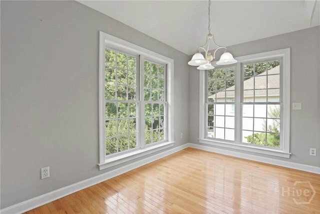 706 Southbridge Blvd, Savannah, GA 31405 - unfurnished room featuring plenty of natural light, a chandelier, and wood-type flooring