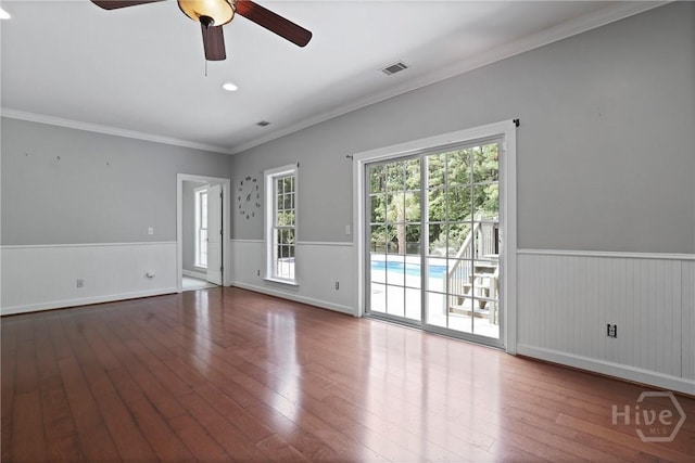 706 Southbridge Blvd, Savannah, GA 31405 - unfurnished room featuring wainscoting, wood-type flooring, a ceiling fan, and crown molding