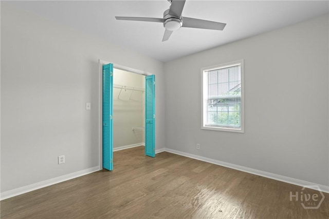 2133 Bacon Park Dr, Savannah, GA 31406 - unfurnished bedroom featuring wood finished floors, a closet, and a ceiling fan