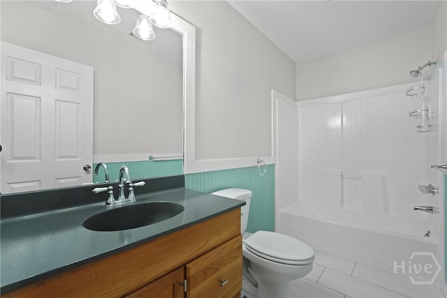 2133 Bacon Park Dr, Savannah, GA 31406 - bathroom with a wainscoted wall, vanity, shower / tub combination, and tile patterned floors