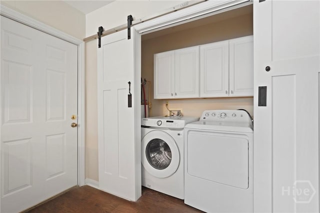 2133 Bacon Park Dr, Savannah, GA 31406 - laundry room with cabinet space, separate washer and dryer, dark wood finished floors, and a barn door