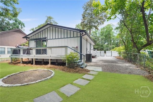 2133 Bacon Park Dr, Savannah, GA 31406 - back of house featuring a fenced backyard, a wooden deck, and board and batten siding
