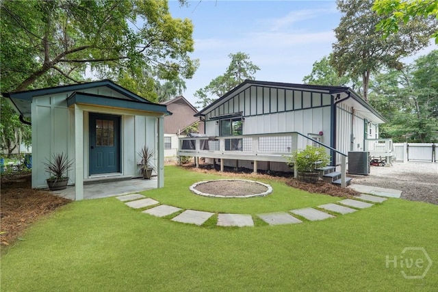 2133 Bacon Park Dr, Savannah, GA 31406 - back of house with board and batten siding, a deck, and an outdoor structure