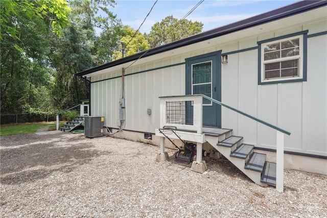 2133 Bacon Park Dr, Savannah, GA 31406 - view of side of property featuring board and batten siding, stairway, and crawl space