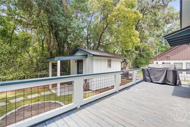 2133 Bacon Park Dr, Savannah, GA 31406 - wooden terrace with view of wooded area, area for grilling, and an outbuilding