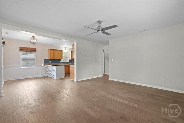 2133 Bacon Park Dr, Savannah, GA 31406 - unfurnished living room with a ceiling fan and wood finished floors