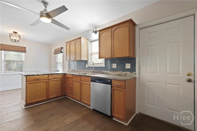 2133 Bacon Park Dr, Savannah, GA 31406 - kitchen featuring dishwasher, a peninsula, dark wood-style flooring, backsplash, and ceiling fan