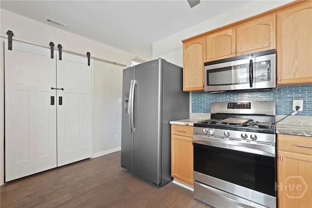 2133 Bacon Park Dr, Savannah, GA 31406 - kitchen with appliances with stainless steel finishes, light brown cabinets, and a barn door