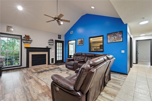 31 Pembroke Pl, Pembroke, GA 31321 - living area featuring ceiling fan, light wood-style flooring, a tiled fireplace, high vaulted ceiling, and recessed lighting