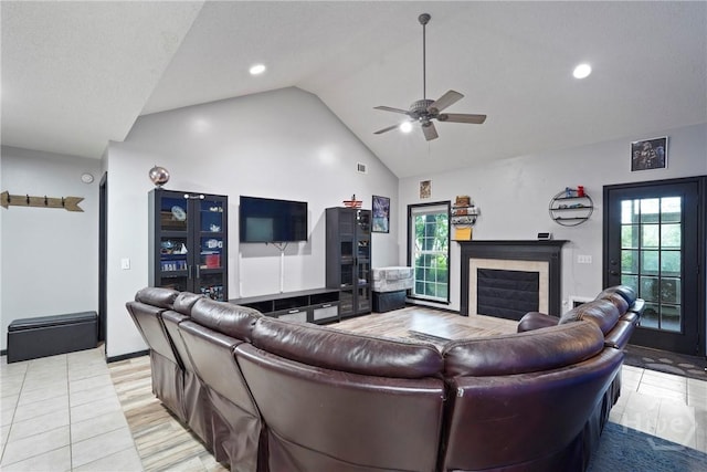 31 Pembroke Pl, Pembroke, GA 31321 - living room with a glass covered fireplace, ceiling fan, healthy amount of natural light, high vaulted ceiling, and recessed lighting
