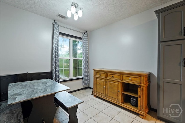 31 Pembroke Pl, Pembroke, GA 31321 - dining room with a textured ceiling and light tile patterned floors
