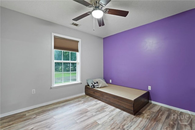 31 Pembroke Pl, Pembroke, GA 31321 - unfurnished bedroom with wood finished floors and ceiling fan