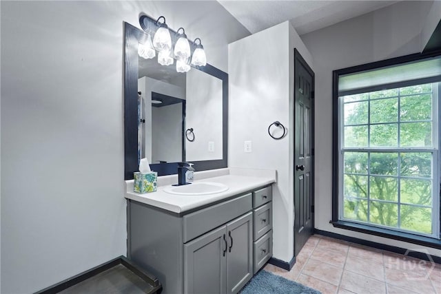 31 Pembroke Pl, Pembroke, GA 31321 - bathroom featuring vanity, tile patterned flooring, and a chandelier