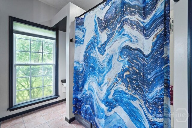 31 Pembroke Pl, Pembroke, GA 31321 - bathroom featuring tile patterned floors and curtained shower
