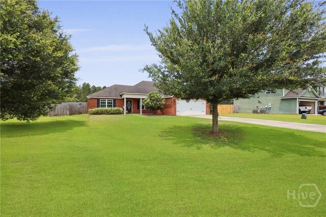 308 NE Mancey Garrason Loop, Ludowici, GA 31316 - view of front facade with concrete driveway and an attached garage