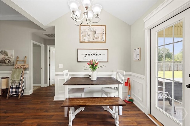 308 NE Mancey Garrason Loop, Ludowici, GA 31316 - dining area featuring a chandelier, vaulted ceiling, wood finished floors, and wainscoting