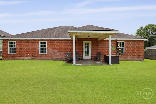 308 NE Mancey Garrason Loop, Ludowici, GA 31316 - back of house with a patio area, brick siding, and a shingled roof