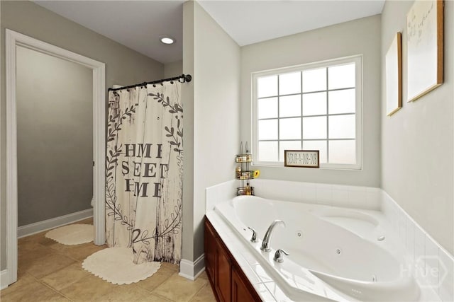 308 NE Mancey Garrason Loop, Ludowici, GA 31316 - full bath with a jetted tub, plenty of natural light, tile patterned flooring, and a shower with curtain
