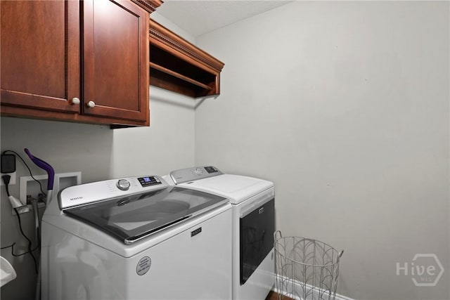 308 NE Mancey Garrason Loop, Ludowici, GA 31316 - laundry area with washing machine and dryer and cabinet space