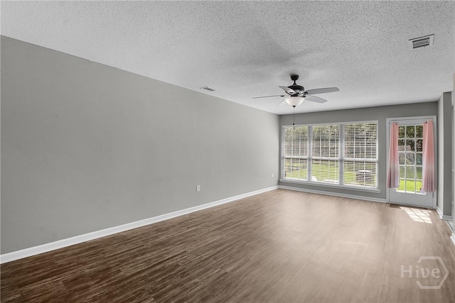 116 Gloucester Dr, Midway, GA 31320 - unfurnished room with ceiling fan, wood finished floors, and a textured ceiling