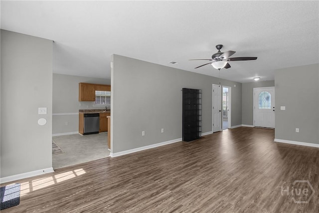 116 Gloucester Dr, Midway, GA 31320 - unfurnished living room with a ceiling fan and wood finished floors
