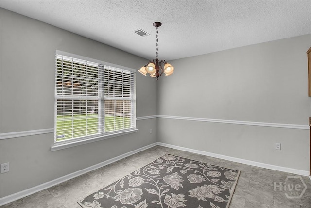116 Gloucester Dr, Midway, GA 31320 - unfurnished room with a chandelier and a textured ceiling